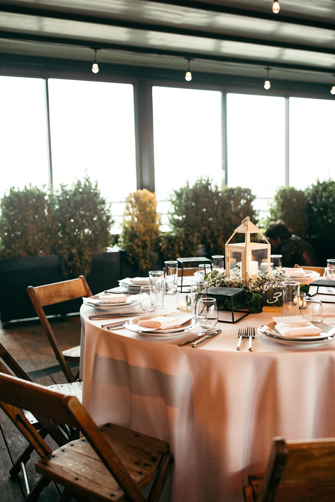A festive holiday table with layered lighting