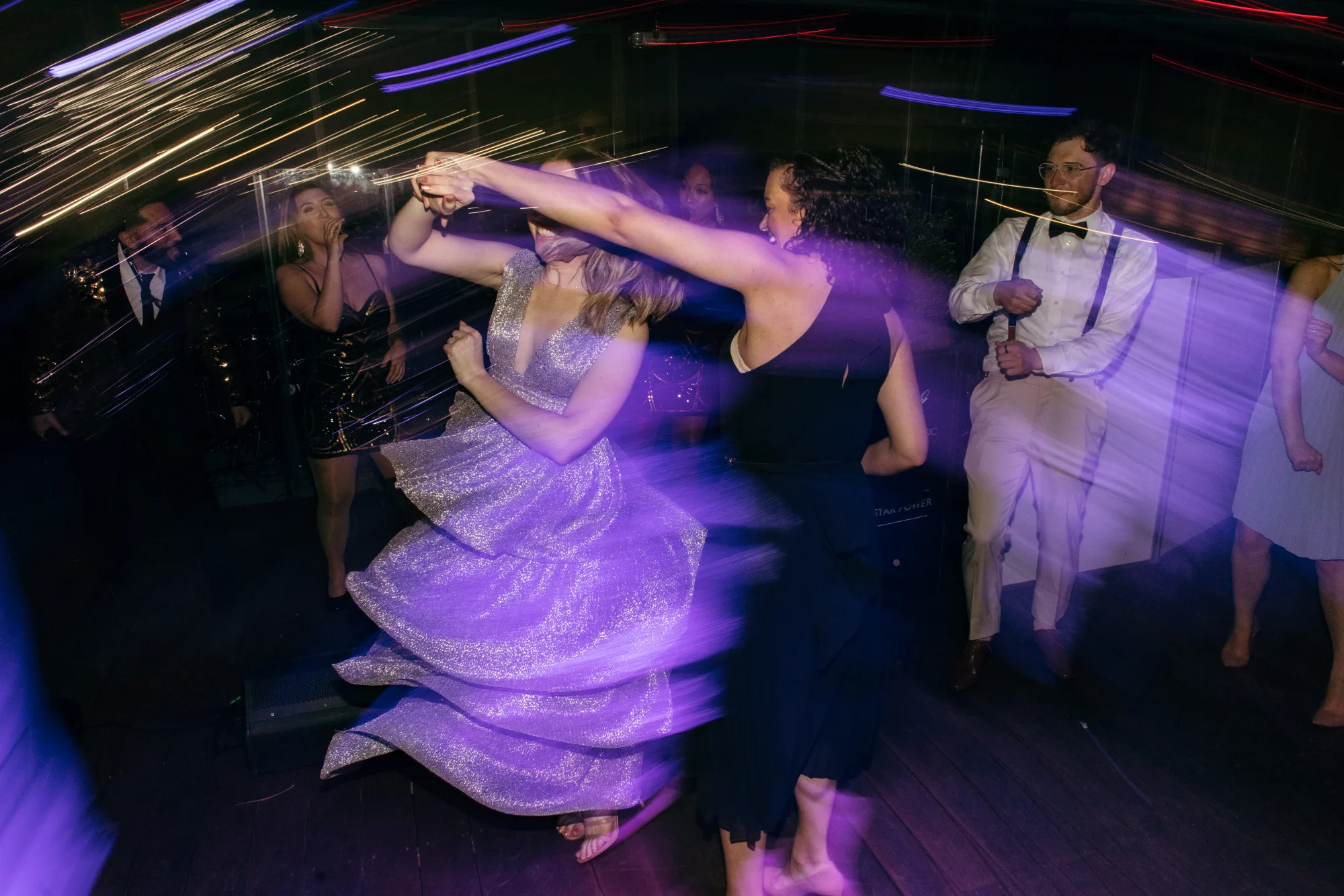Atmospheric lighting over a holiday dance floor