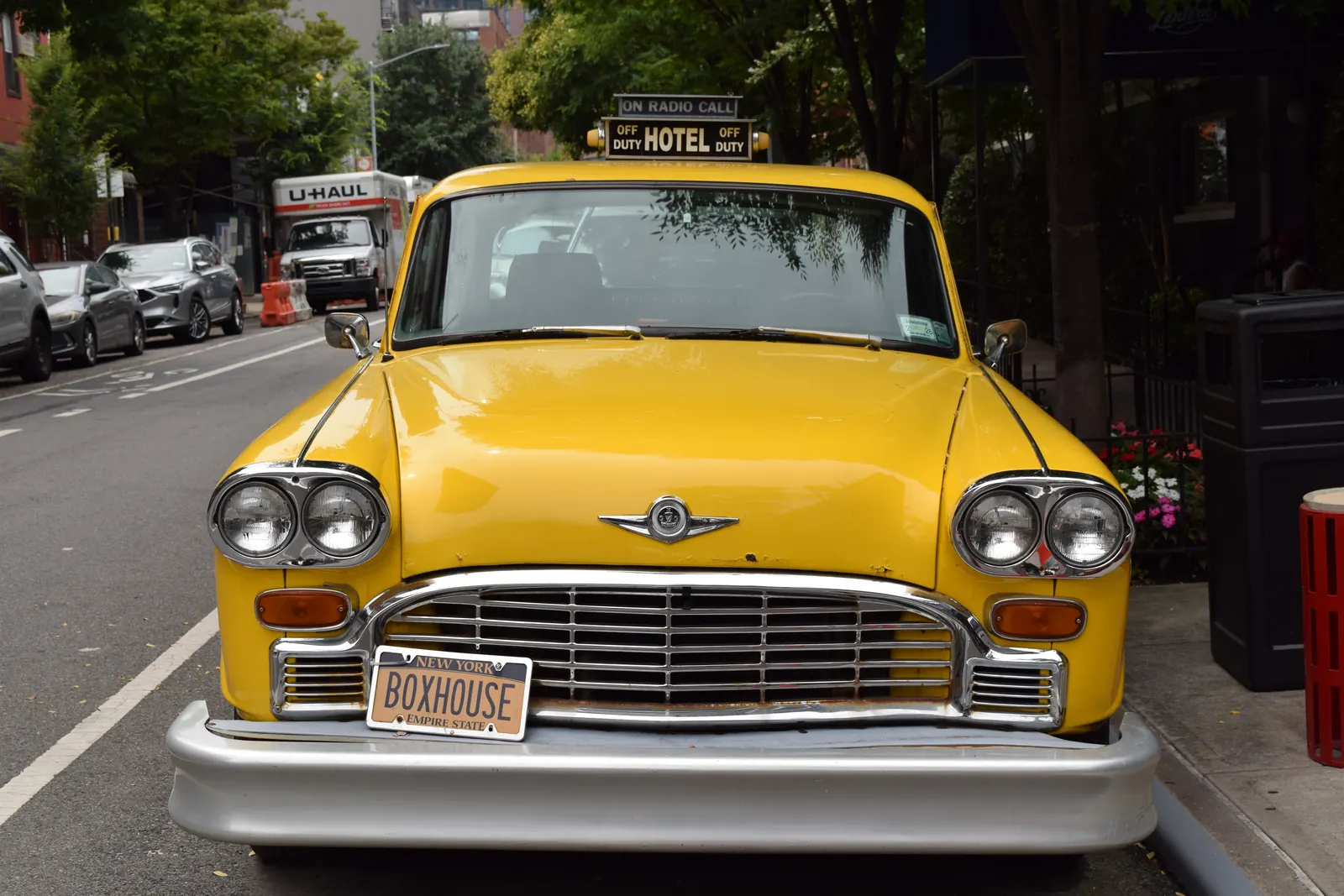 The vintage yellow Checker cab outside The Box House Hotel in Greenpoint, Brooklyn, one subway transfer from the US Open in Flushing Meadows.